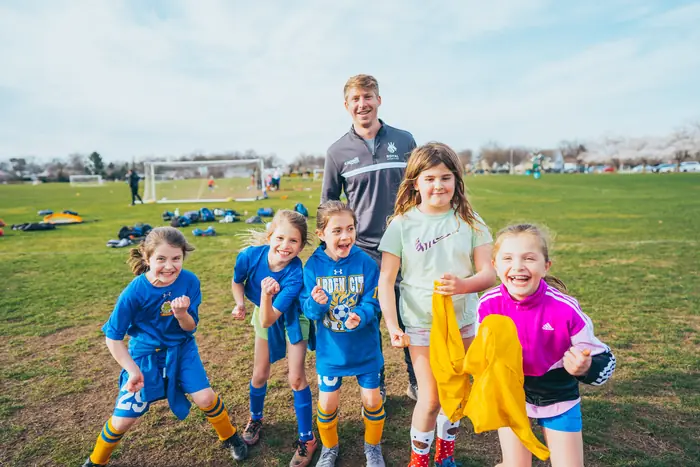 Young players celebrating at training